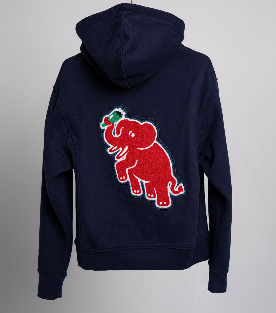 Navy blue hoodie with a red elephant chenille patch on the back against a gray background
